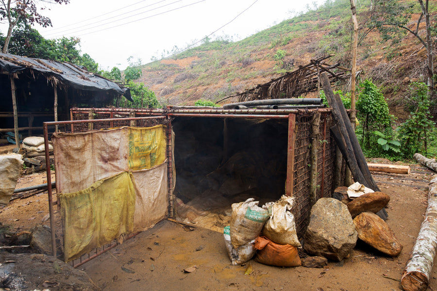 Excavated gem-bearing soil stored in a lockable cage, awaiting an auspicious day to begin the washing process