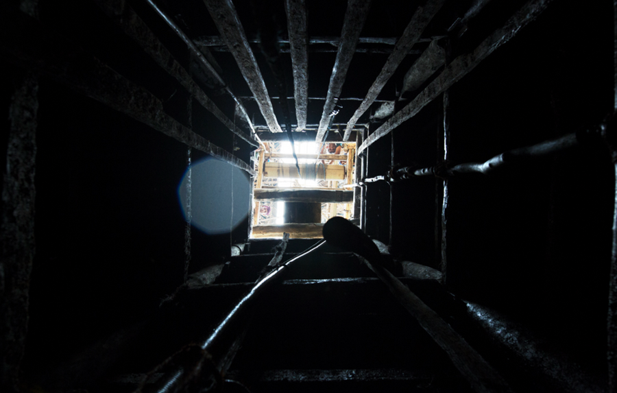 Looking straight up from the floor of a 30-foot hillside mine pit